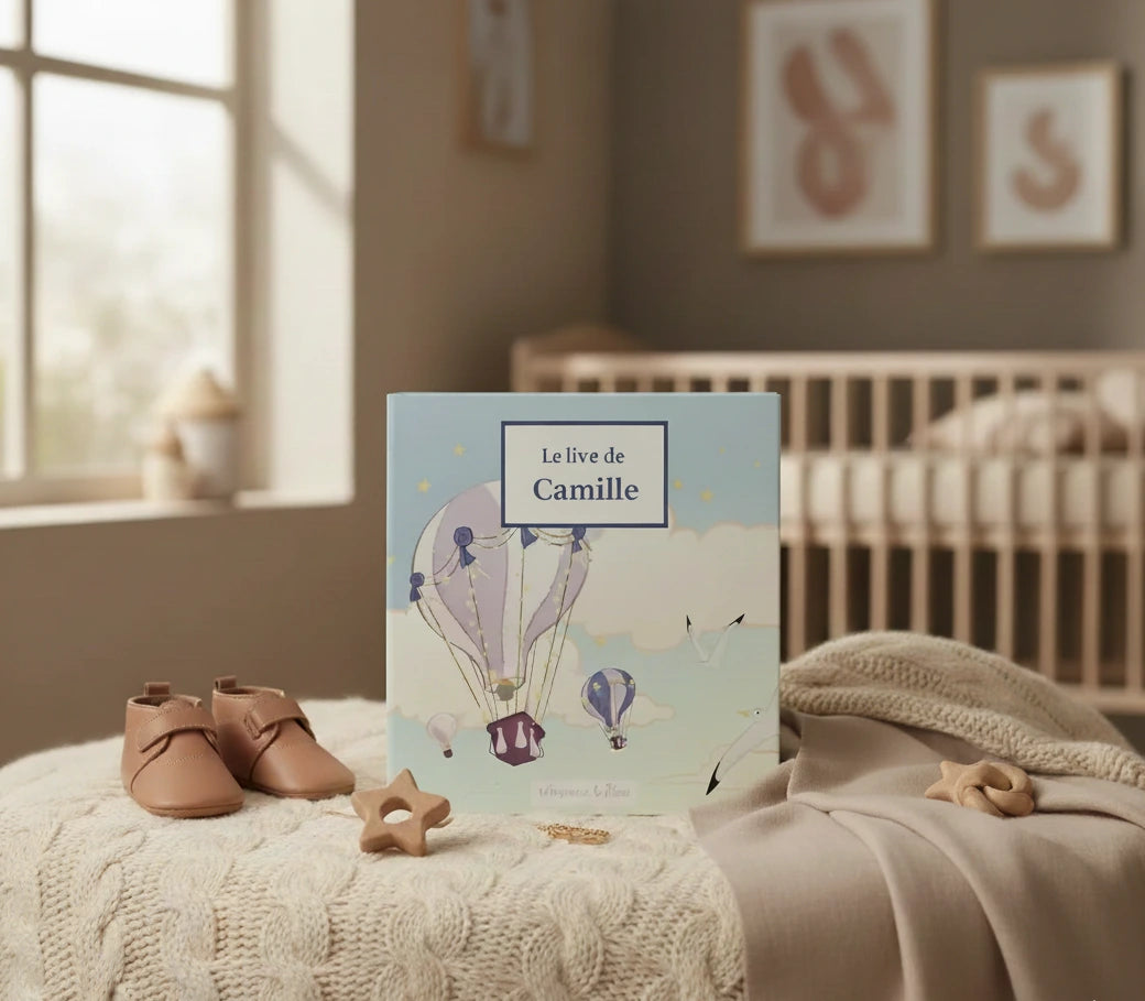 Album-photo-montgolifière dans une chambre type beige mum, inscrit sur la couverture: le livre de Camille