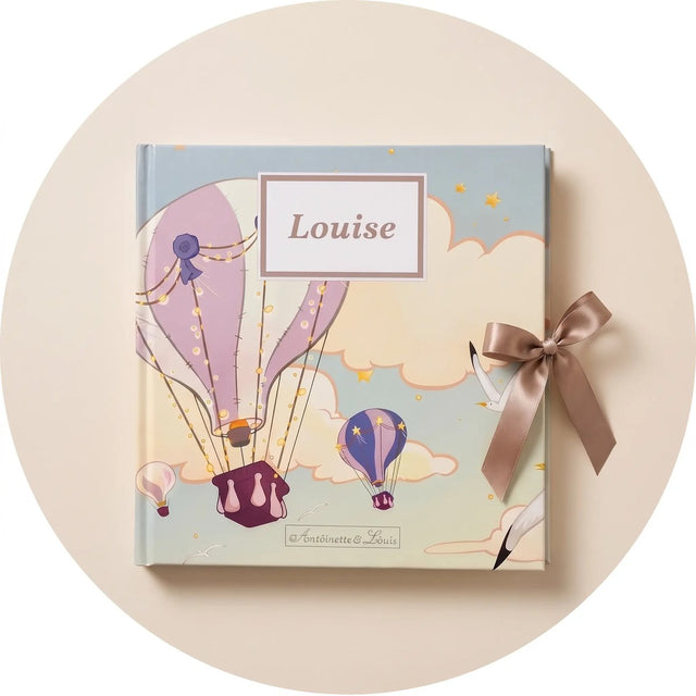 Album de naissance personnalisé avec le prénom Louise sur la couverture